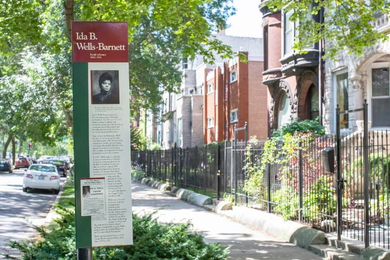 A sign detailing the life of Ida B. Wells-Barnett. 