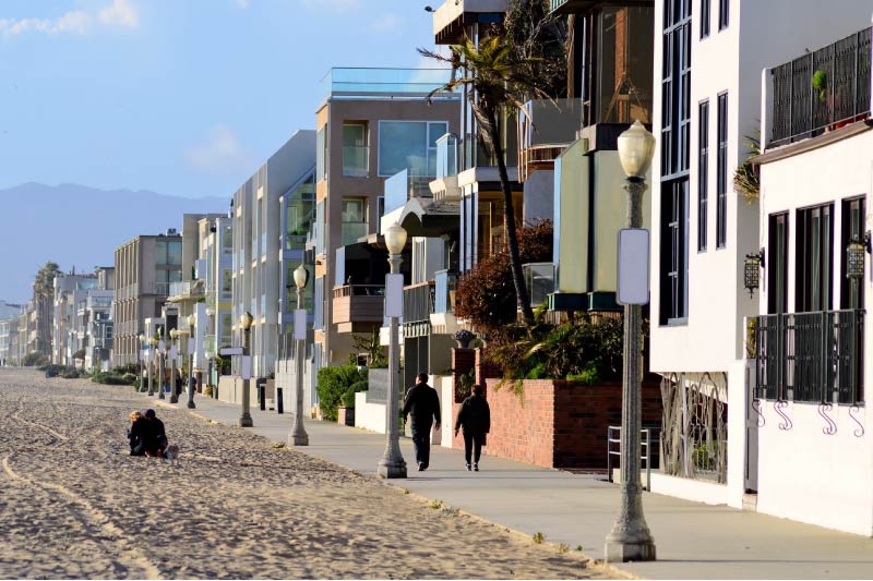 People walking along the beach in Marina del Rey. 