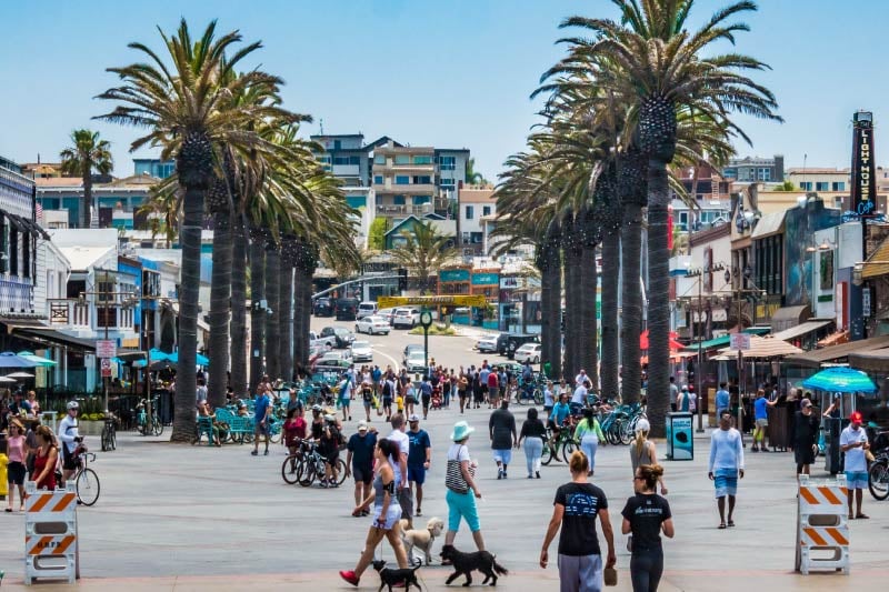 People enjoying the weather at Hermosa Beach Pier Plaza