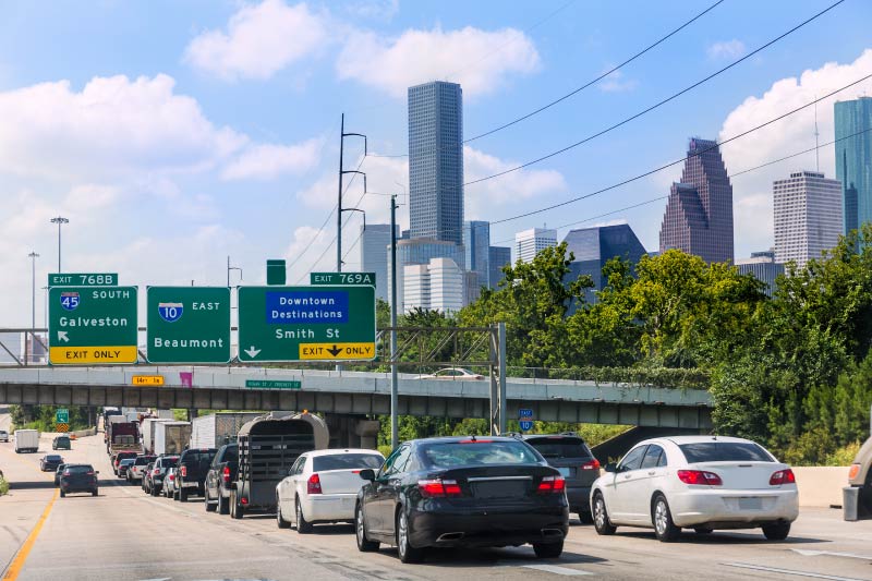 Cars waiting to exit the highway and enter downtown Houston. 
