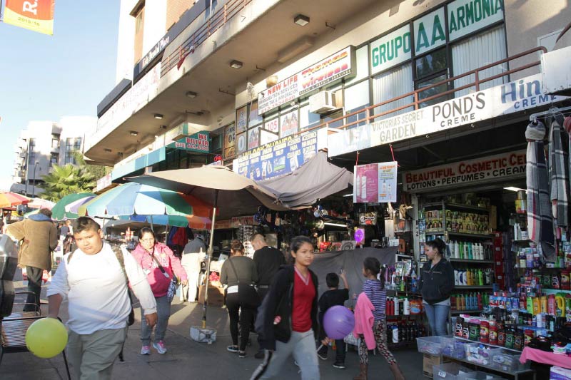 People walking through the Westlake neighborhood of Los Angeles. 