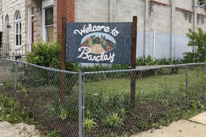 A "welcome to Barclay" sign.