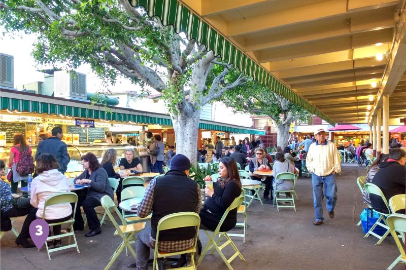 People eating at the Original Farmers Market. 