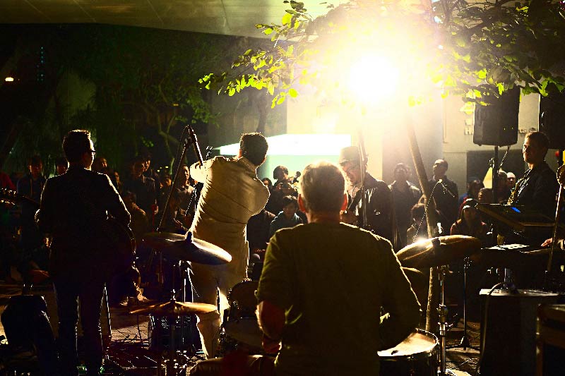 A band performing in front of a crowd