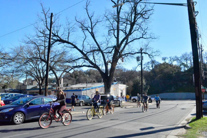 People biking along Barton Springs Rd. 