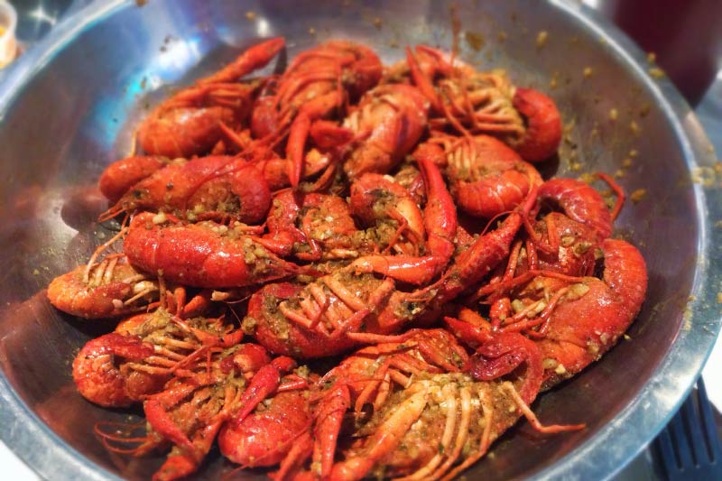 A bowl filled with crawfish. 