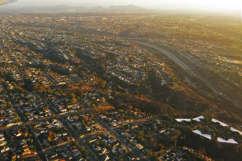 Aerial image from airplane looking down on residential neighborhood and geography.