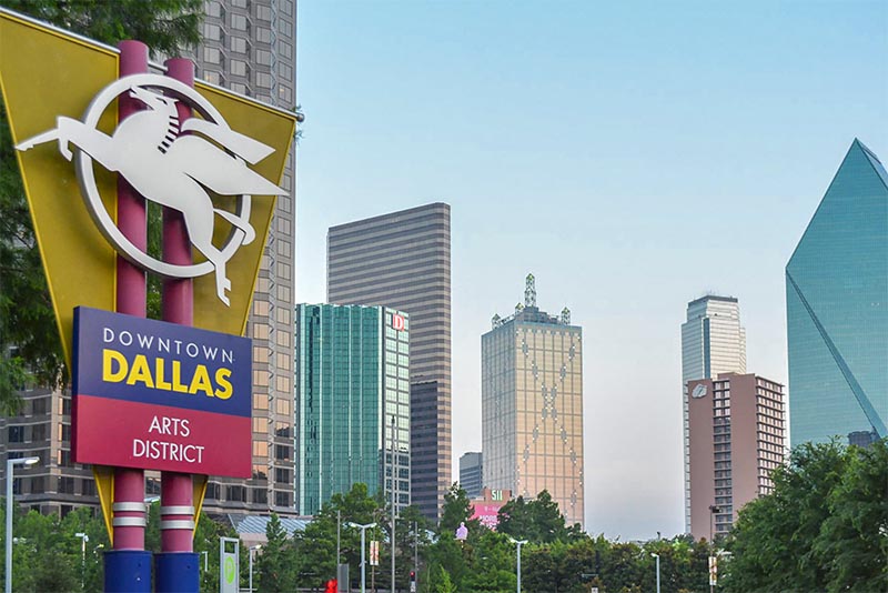 A sign in Downtown Dallas Texas shows where the Arts District is