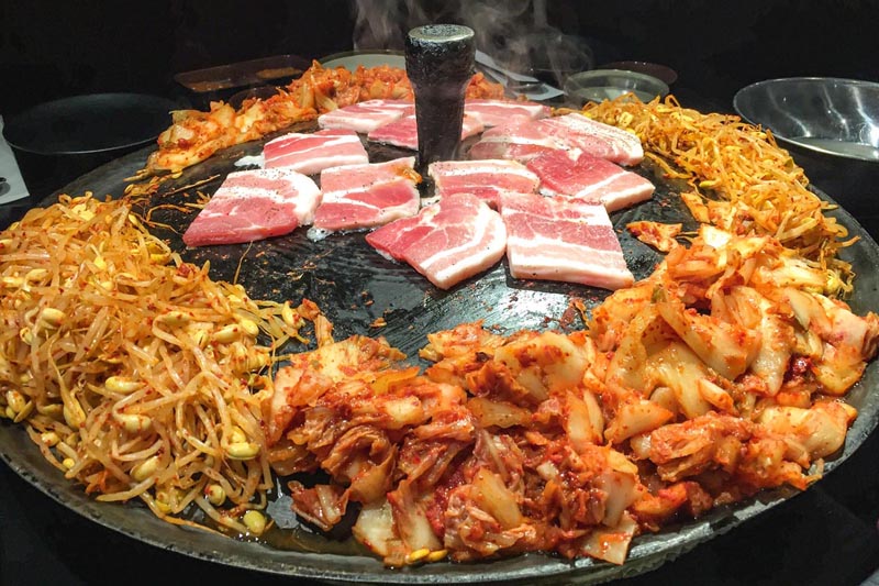 Kimchi and bacon on a Korean barbecue
