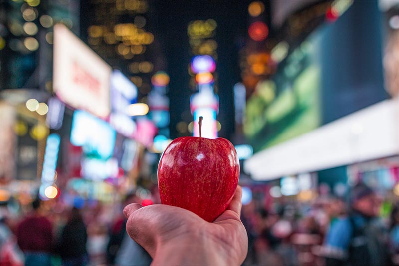An apple held up in The Big Apple, New York City