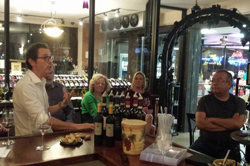 View of patrons at the bar at the Bottle Shop in Sierra Madre. 