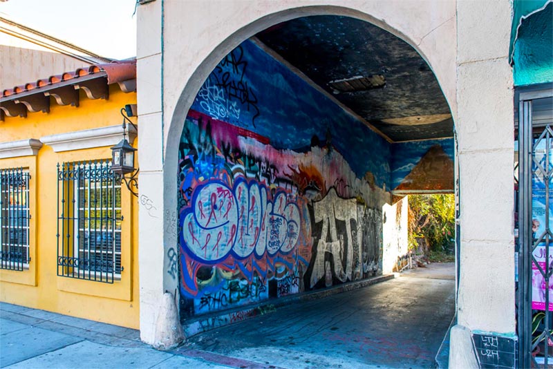 Archway with colorful art and graffiti in Boyle Heights, Los Angeles.