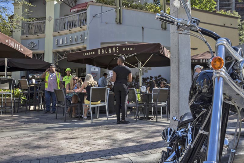 outdoor cafe with people eating and drinking