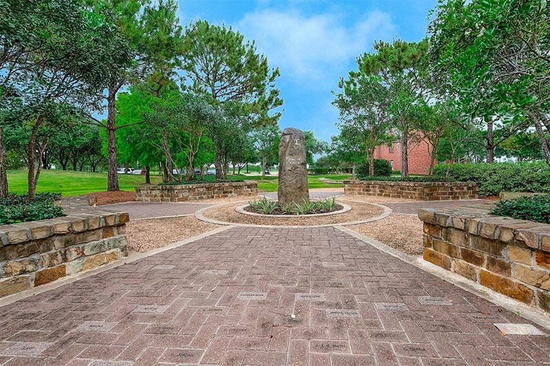A park with a seating area in the Bridgeland community in Texas