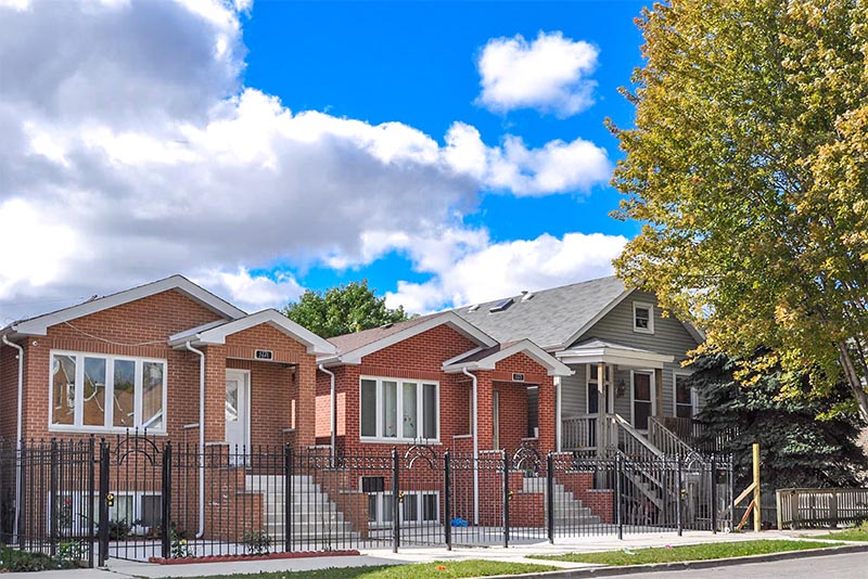 A row of ranch-style brick homes on a residential street in Bridgeport Chicago