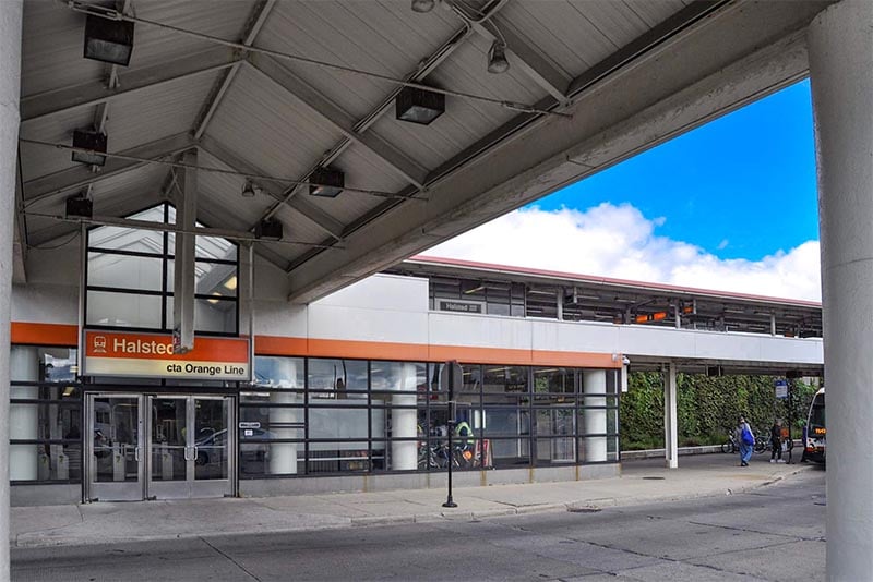 A view from across the street of the entrance to an Orange Line CTA stop in Bridgeport Chicago