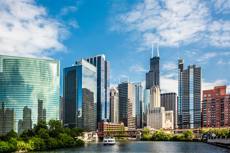 An upward view of Chicago skyscrapers from the Chicago River