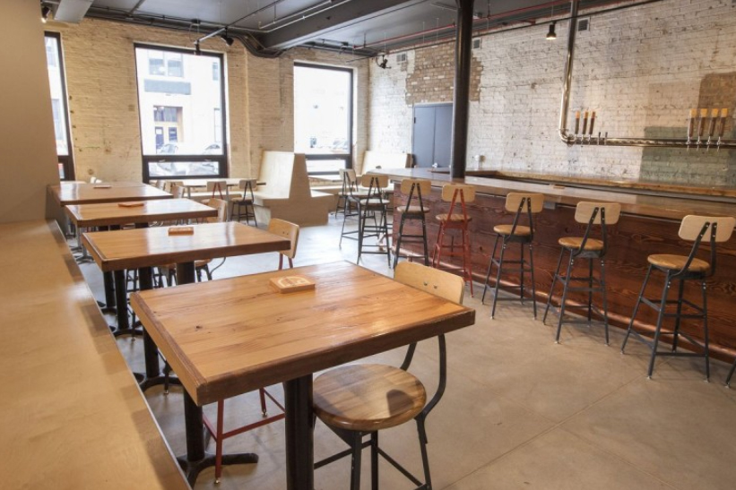 Woden tables and empty bar at Dovetail Brewery.