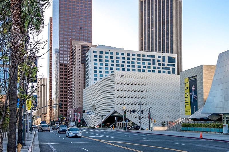 The Broad Art Museum and its unique facade on a street in Downtown Los Angeles with buildings rising around it