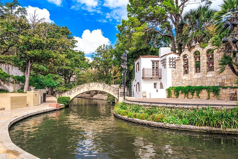 The famous San Antonio Riverwalk with its stone walls and bridges