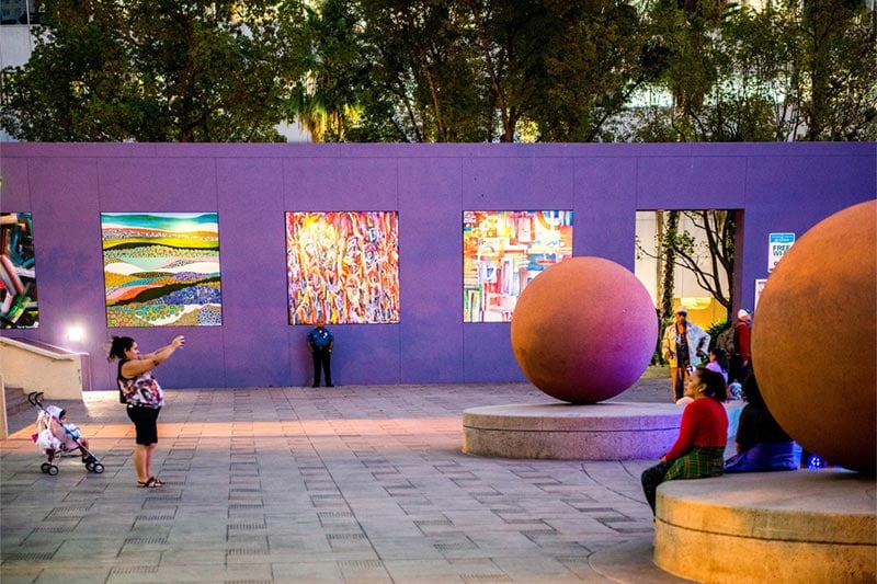 People taking pictures in front of sculptures and art in Downtown Los Angeles.