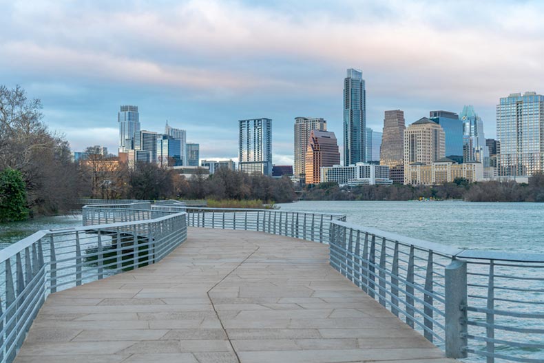 A large, cement path leading to Downtown Austin in the morning
