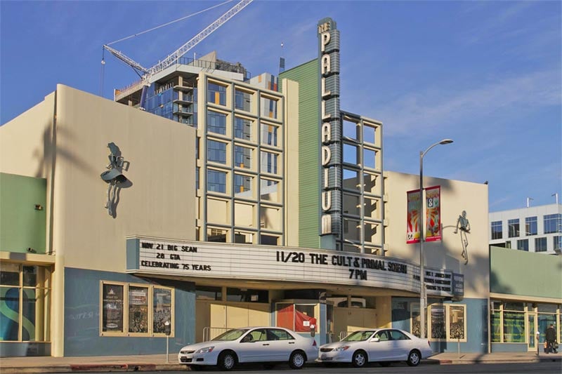 Exterior of people walking past movie Theater in East Hollywood.