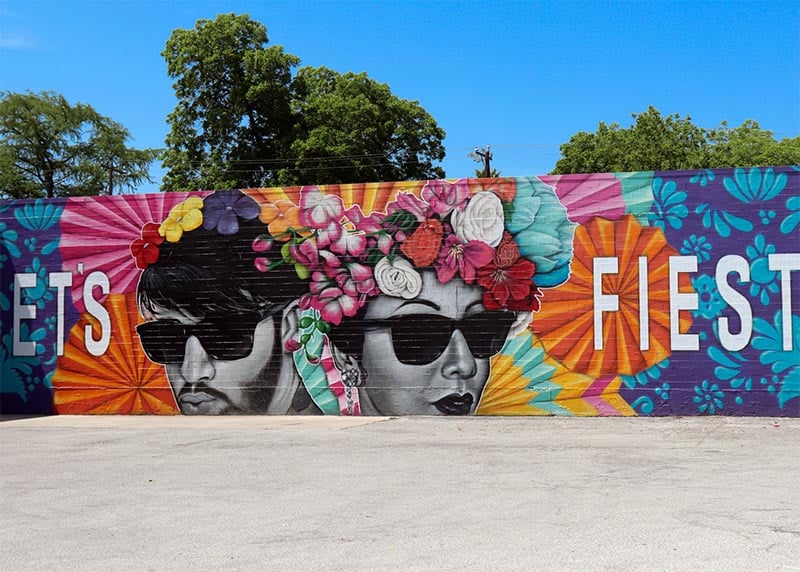 A mural in San Antonio TX reading Let's Fiesta