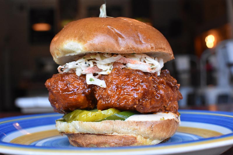 Closeup on a fried chicken sandwich on a plate in Chicago, Illinois