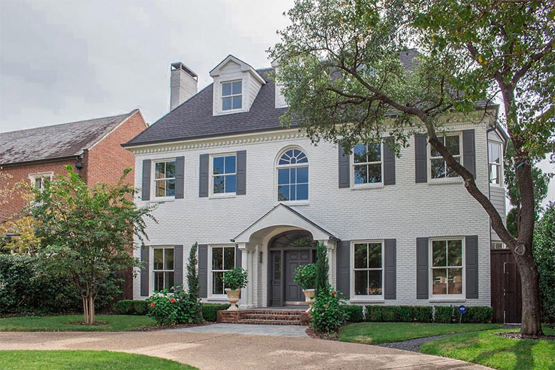 A large home on a residential block of Highland Park in Dallas Texas