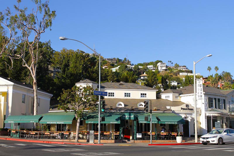 corner of intersection with hollywood hills neighborhood in the background