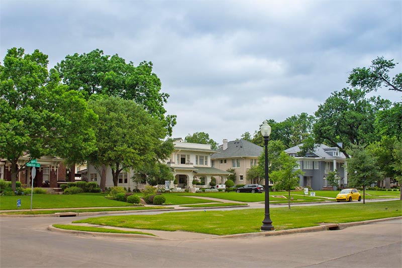 multiple home exteriors along neighborhood street