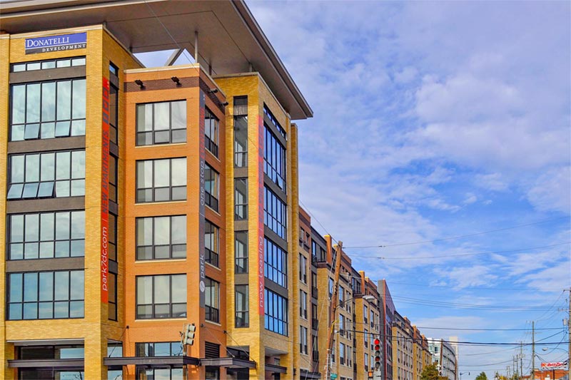 top of condo buildings and dc skyline