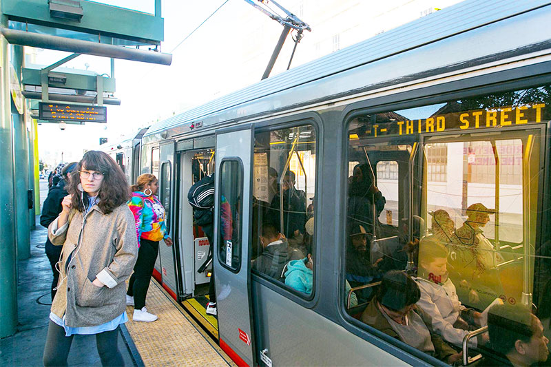 Passengers boarding the T Line in San Francisco