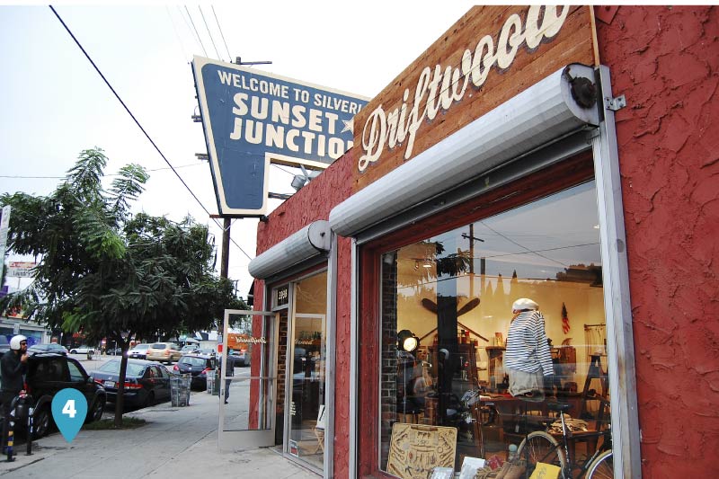 A boutique with the Sunset Junction sign on top. 