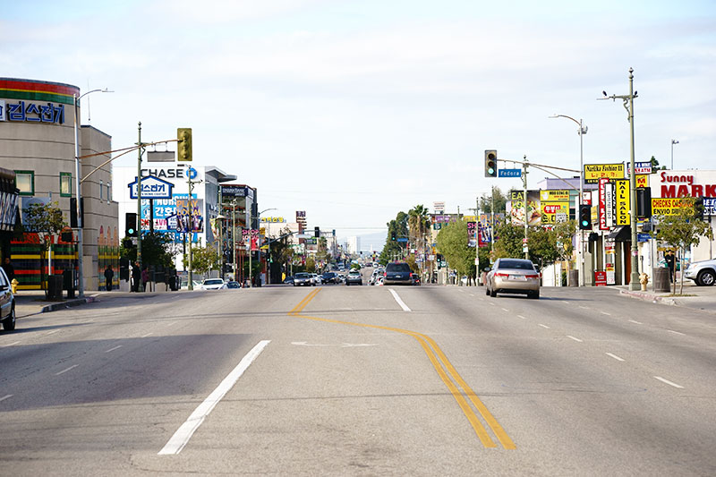 View down a street in the Koreatown neighborhood of Los Angeles, California