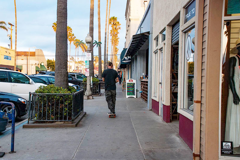 A sidewalk beside a row of shops in the Ocean Beach neighborhood of San Diego, California