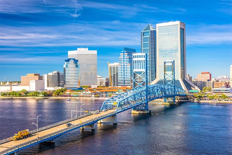 The skyline of Jacksonville Florida with a bridge leading into the downtown area