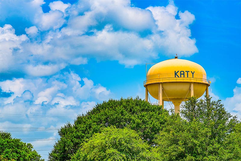 The Katy, Texas water tower above trees