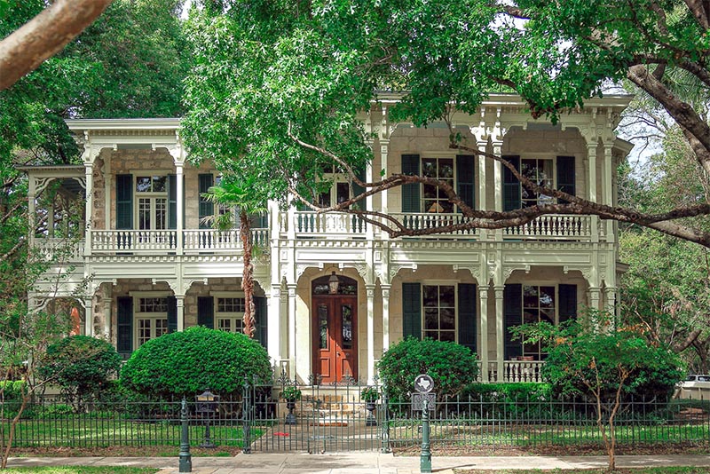 A historic white house sits in San Antonio's King William Historic District