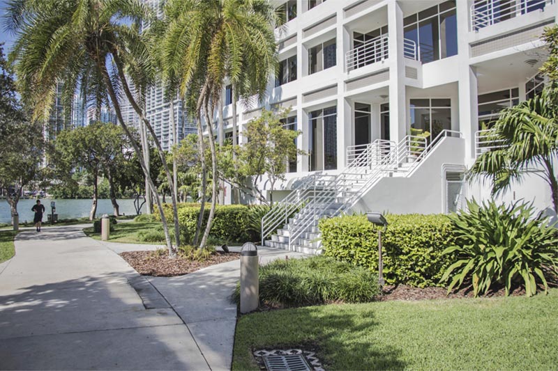 entrance of miami condo building by the ocean