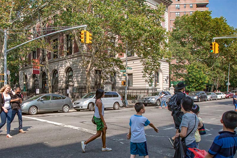 People walking across the street in Lower East Side Manhattan