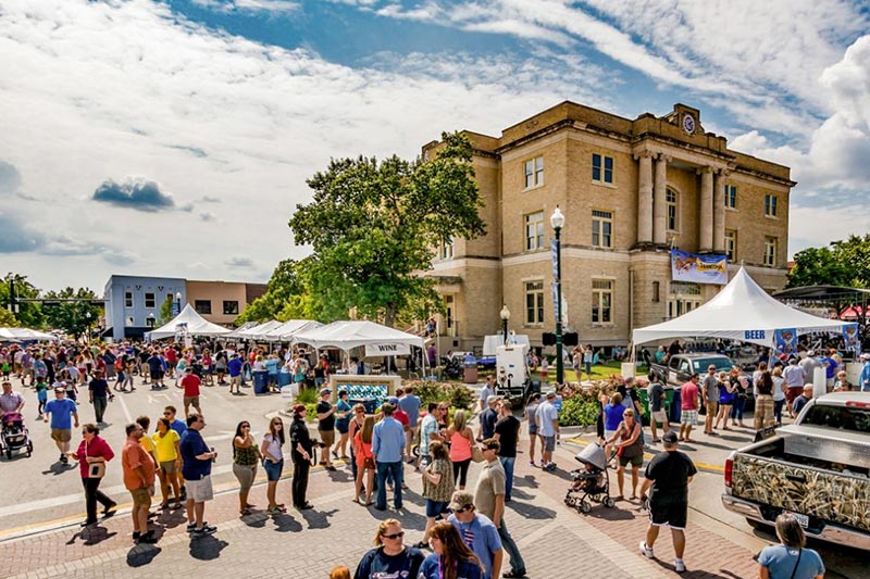 People walking around the downtown area of McKinney, Texas