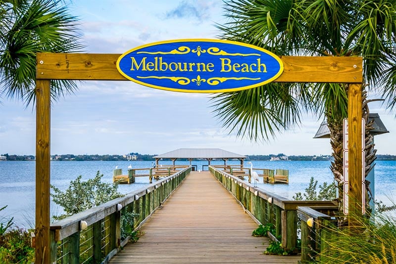 A pier marked Melbourne Beach right outside Melbourne Florida