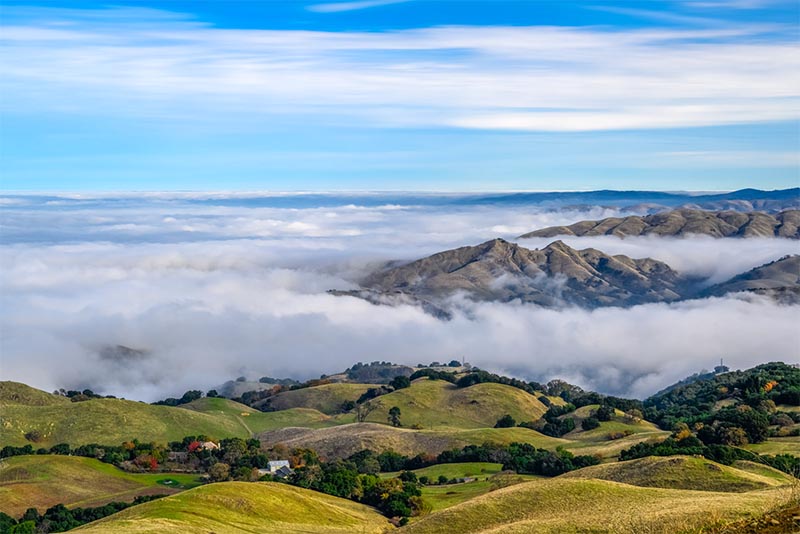 Hills and mountains shrouded in clouds and fog in San Francisco