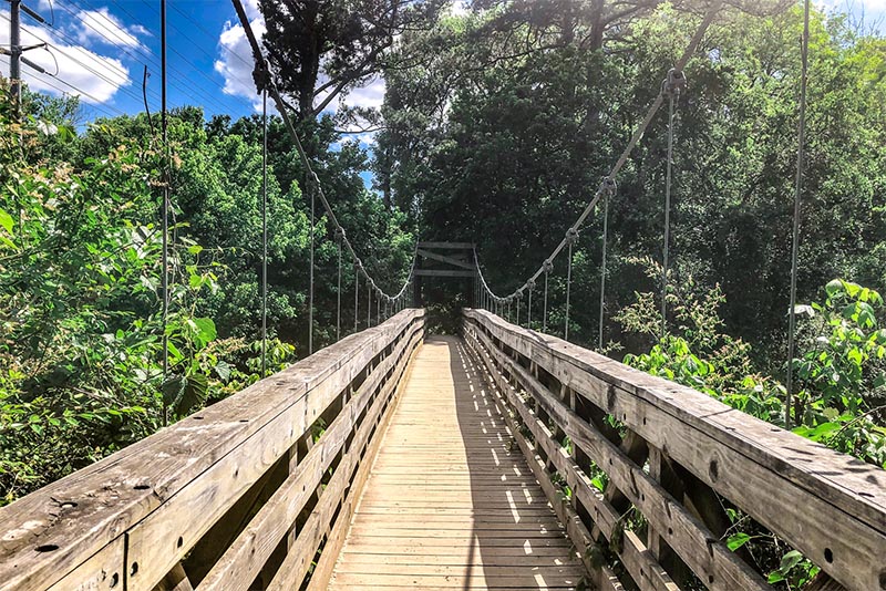 A wooden bridge trail in Morningside Nature Preserve in Atlanta Georgia