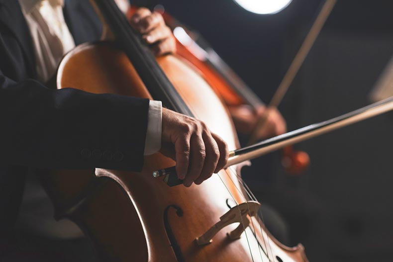 Close-up on a cellist performing on stage