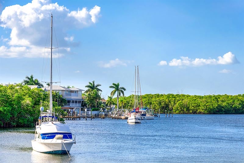 Boats circle away from a pier in Palm Bay Florida