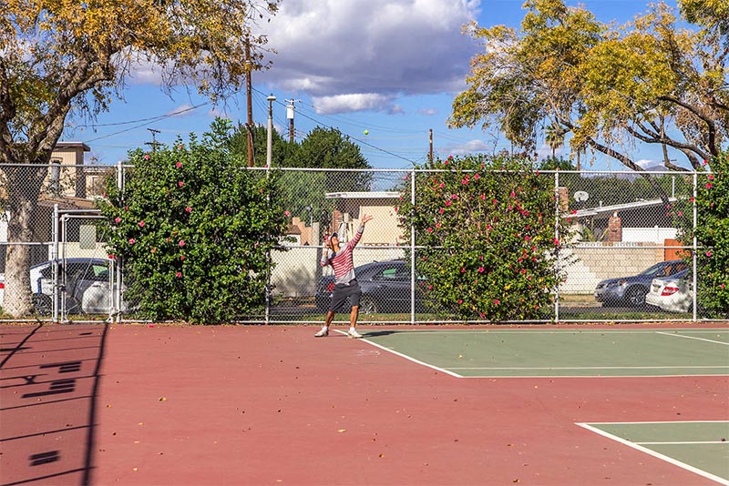 A person playing tennis in the Panorama City neighborhood of Los Angeles California