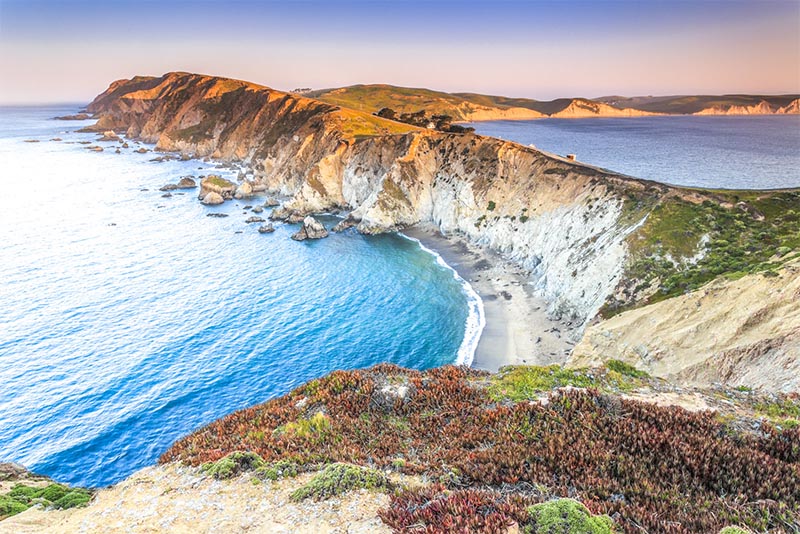 A view down a cliff to Point Reyes along the ocean in San Francisco